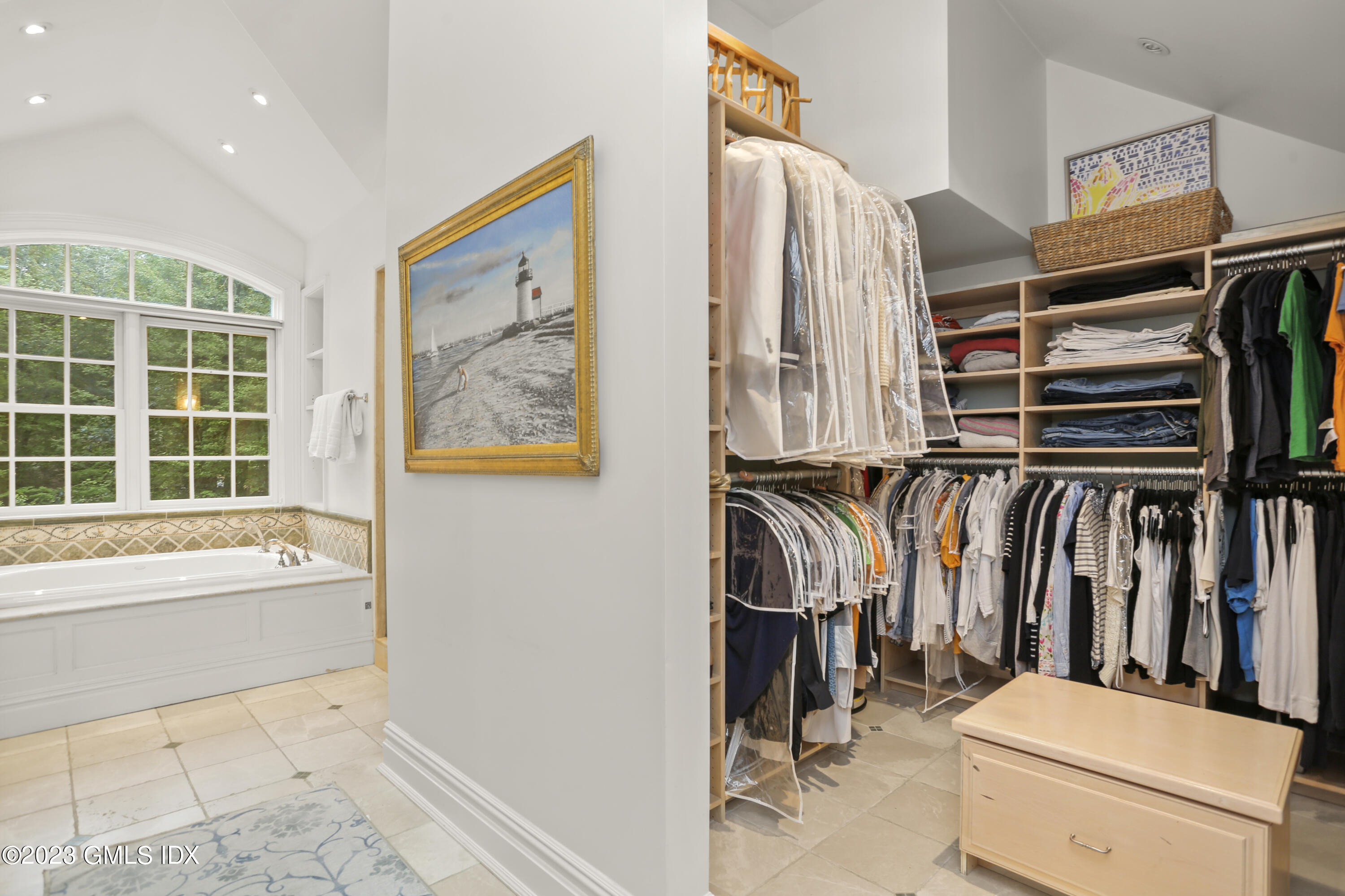 375 Stanwich Road Greenwich, CT 06830 - Photo 18 of 31 a view of walk in closet with clothes and shoes