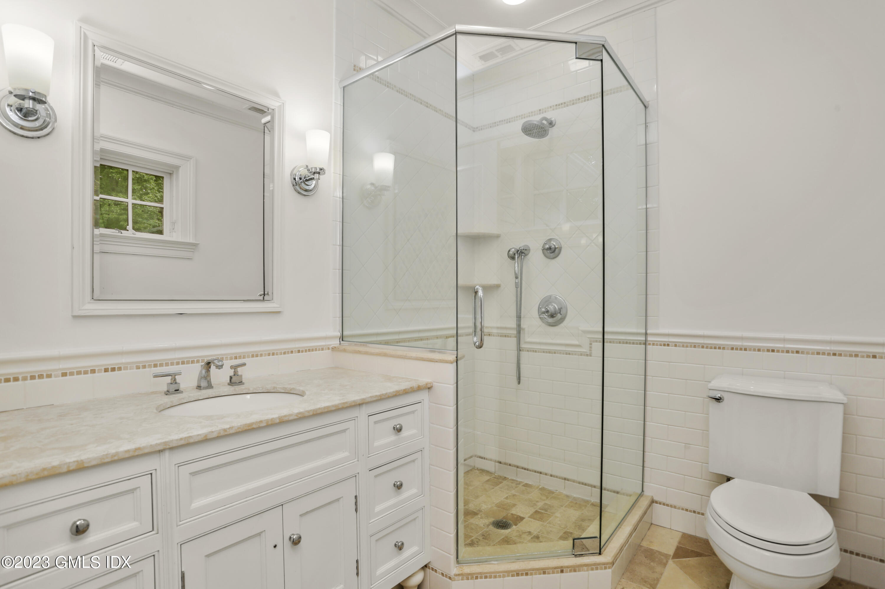 375 Stanwich Road Greenwich, CT 06830 - Photo 23 of 31 a bathroom with a granite countertop sink toilet and shower
