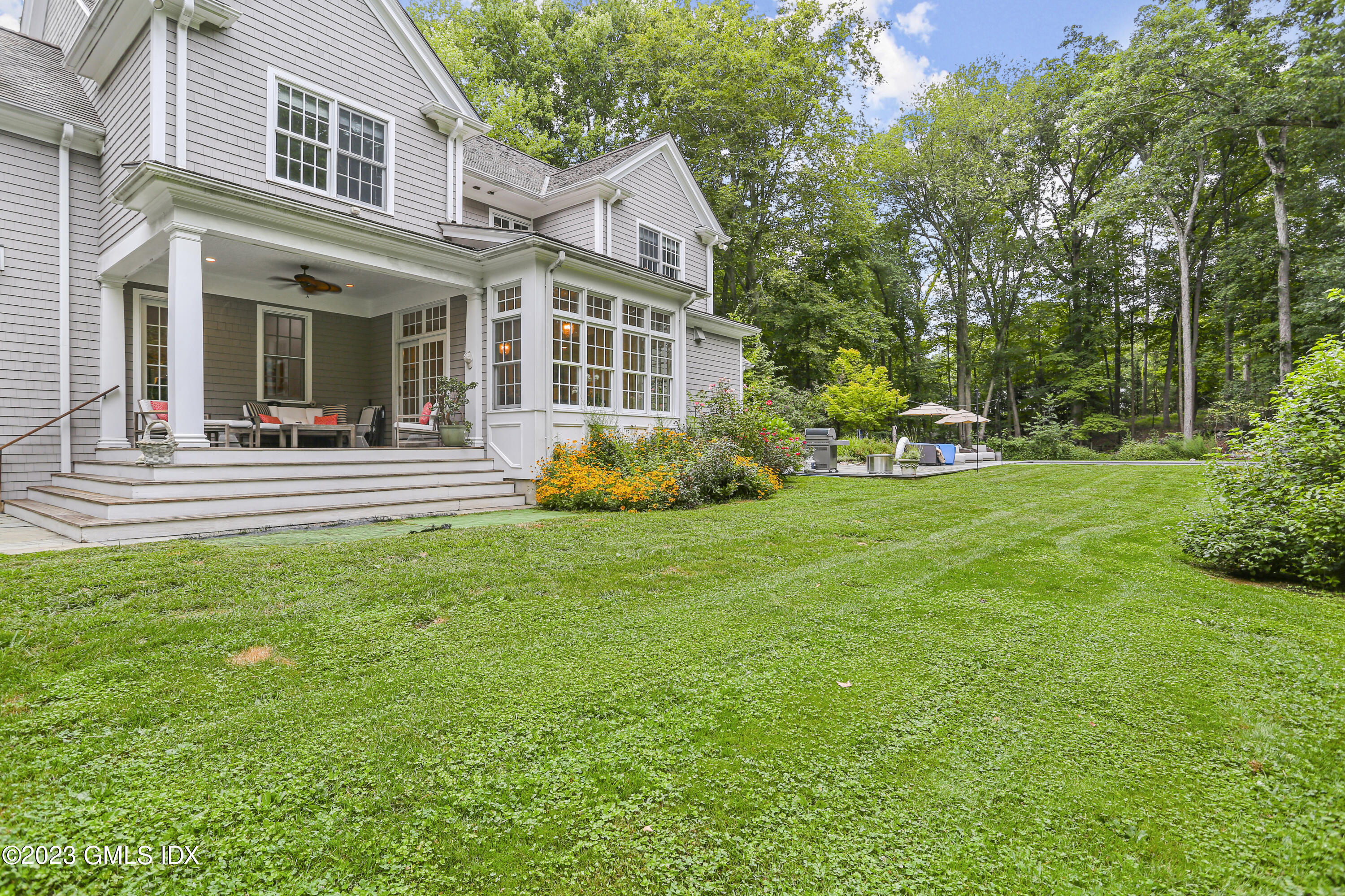 375 Stanwich Road Greenwich, CT 06830 - Photo 24 of 31 front view of a house with a yard