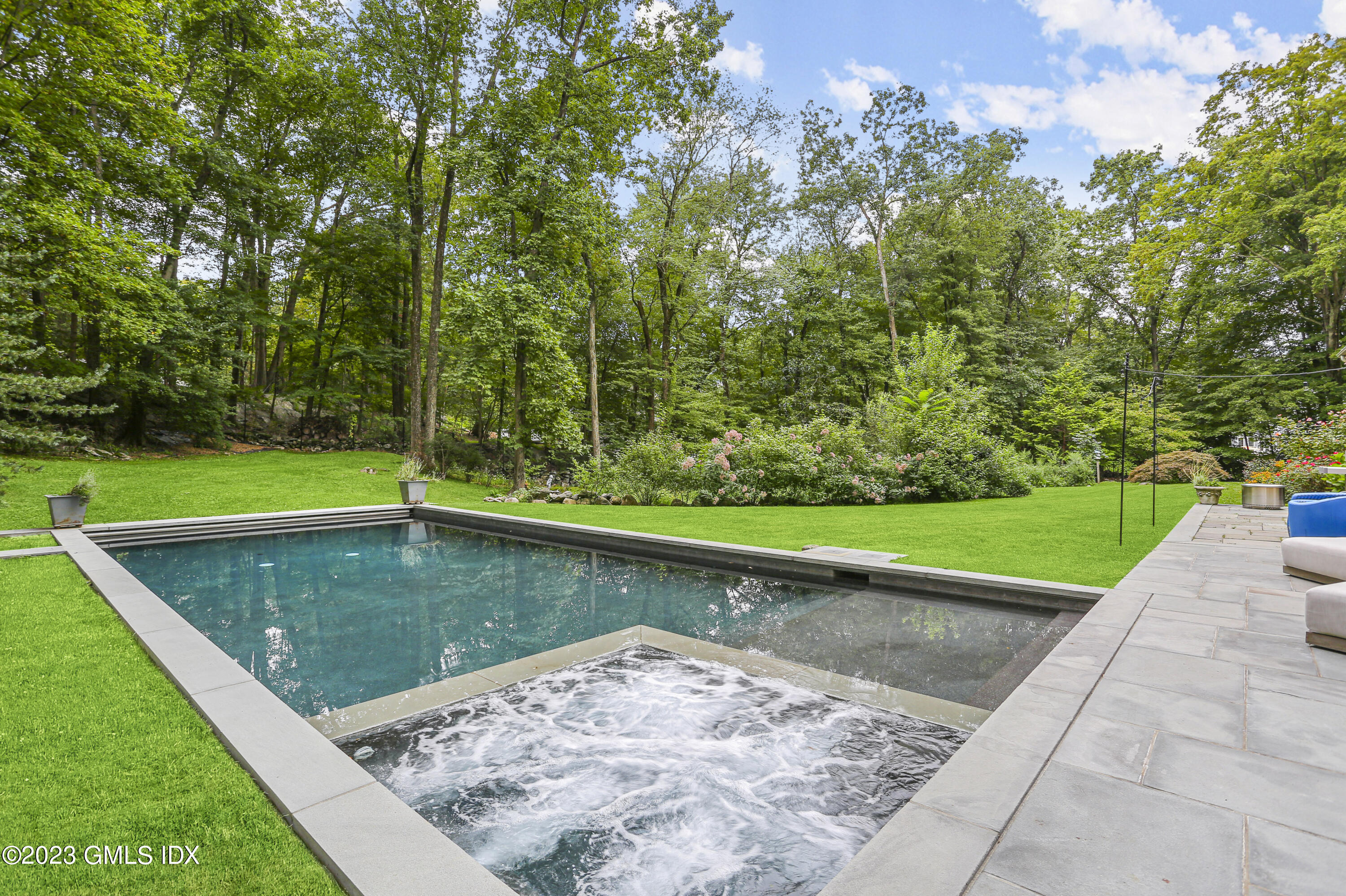 375 Stanwich Road Greenwich, CT 06830 - Photo 27 of 31 a view of a swimming pool with a patio