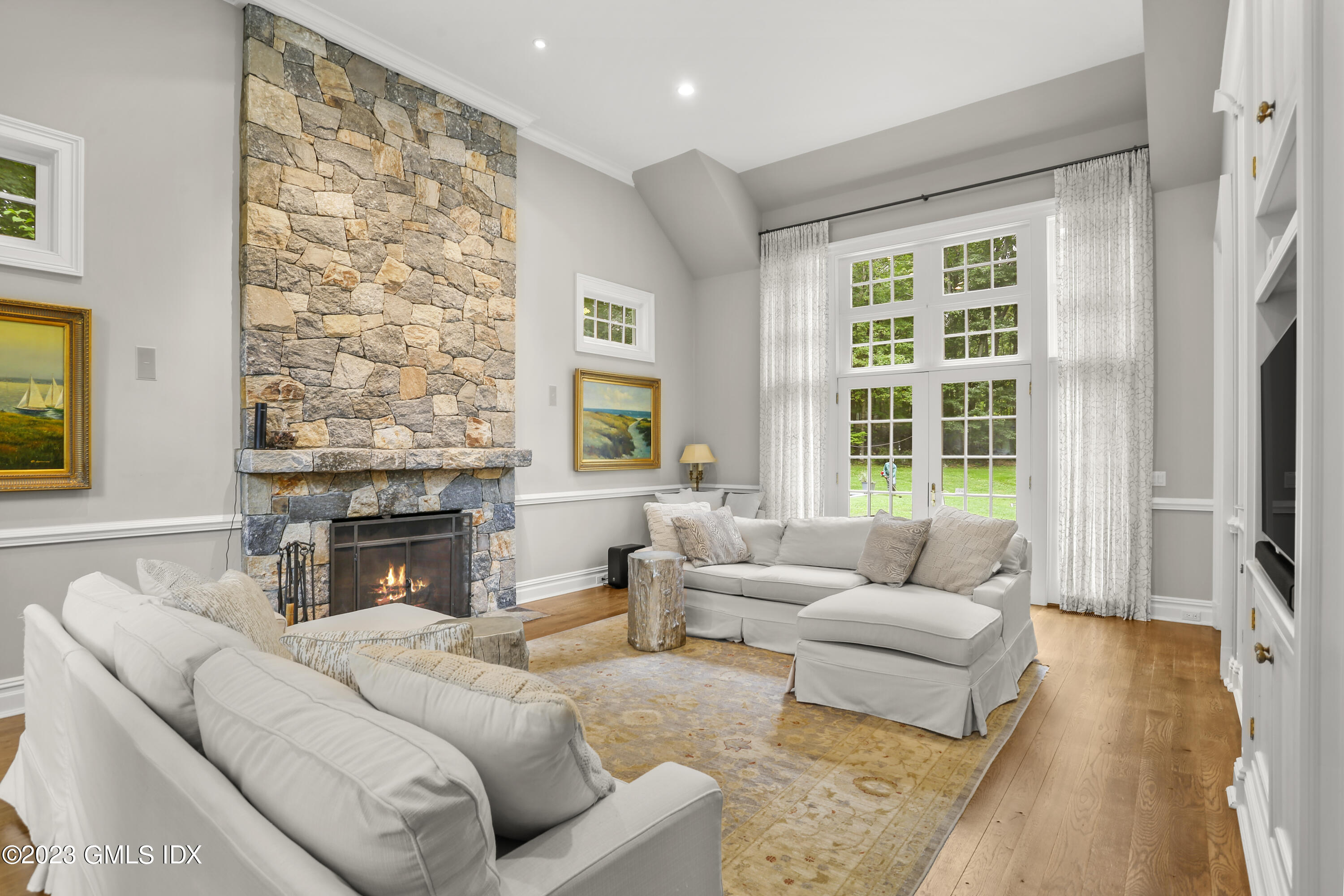 375 Stanwich Road Greenwich, CT 06830 - Photo 8 of 31 a living room with furniture and a fireplace