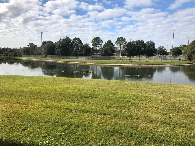 a view of a lake with a big yard