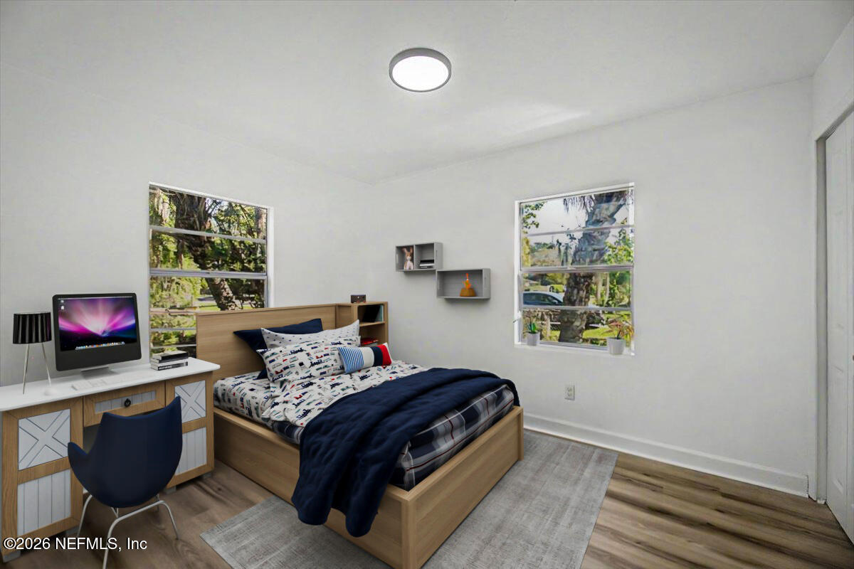2520 Larsen Road Jacksonville, FL 32207 - Photo 16 of 27 a bedroom with a bed and a window