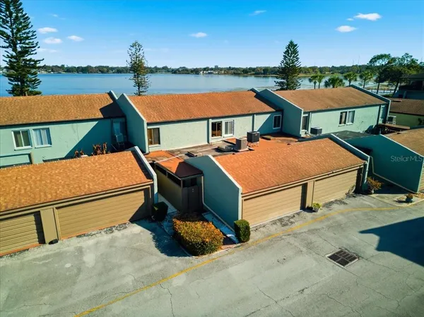 an aerial view of a houses with outdoor space