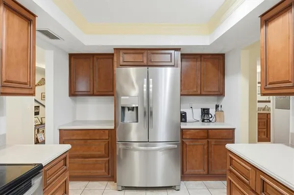 a kitchen with stainless steel appliances a refrigerator sink and cabinets