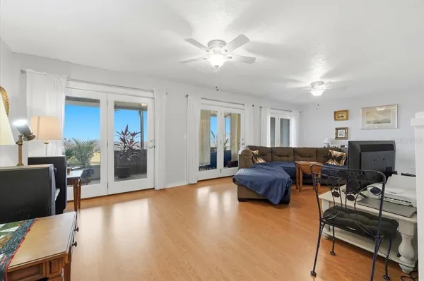 a living room with furniture and a chandelier