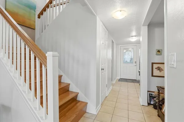 a view of a hallway view with staircase