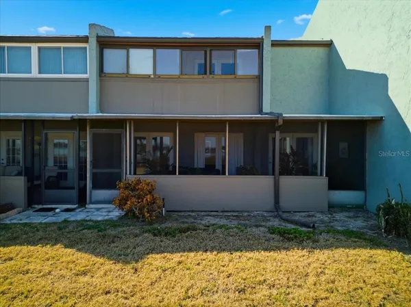 a view of house with backyard and garden