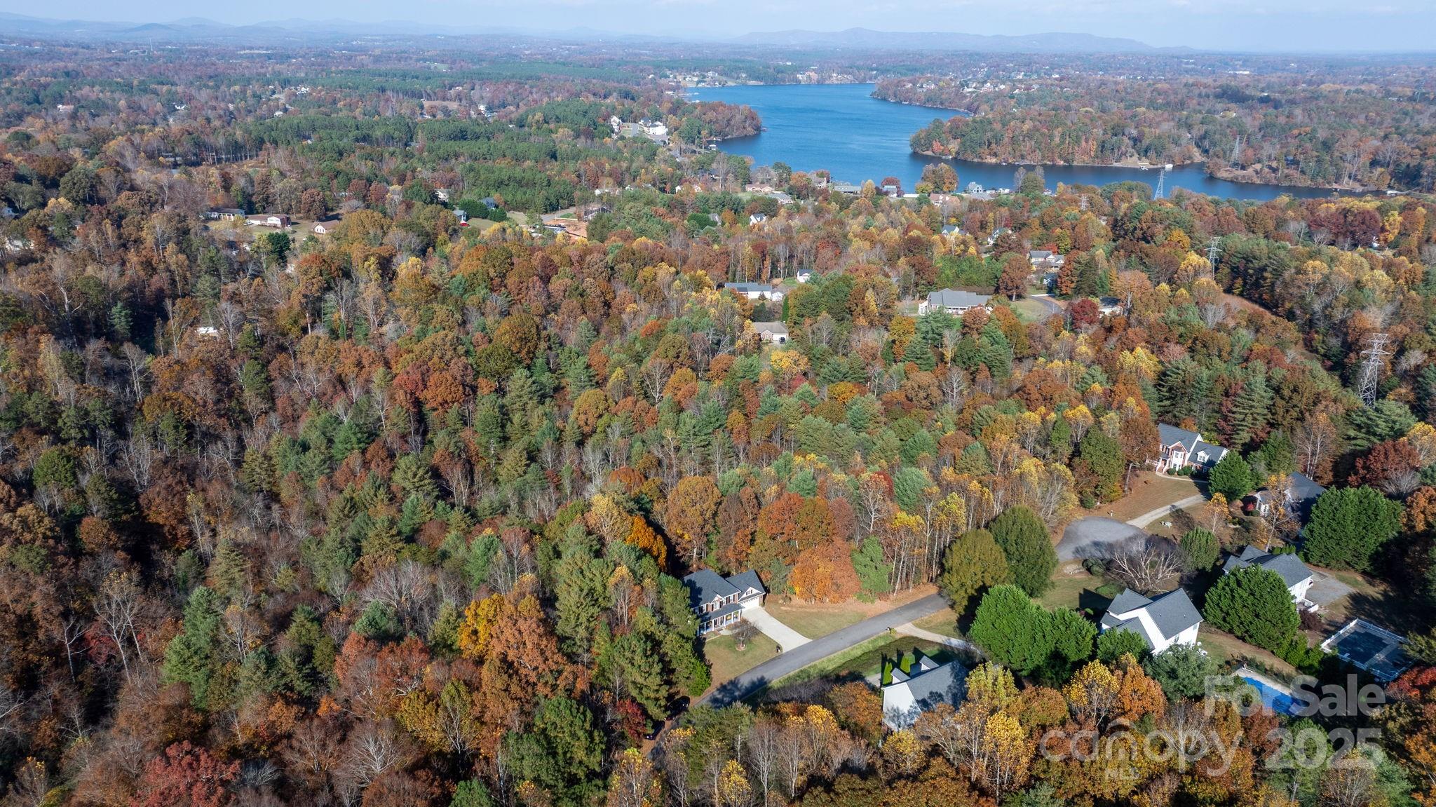 5665 Crown Terrace Hickory, NC 28601 - Photo 11 of 45 an aerial view of house with yard and mountain in the back
