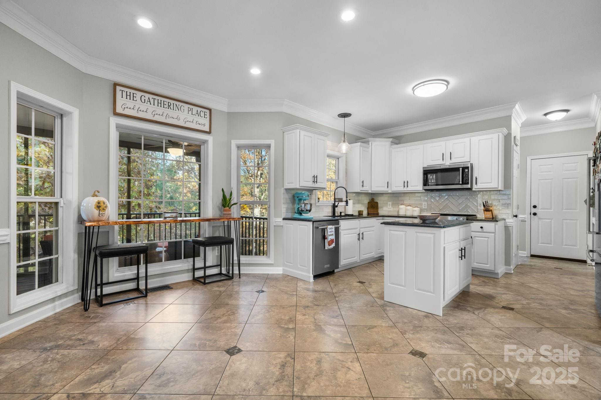 5665 Crown Terrace Hickory, NC 28601 - Photo 15 of 45 a kitchen with stainless steel appliances granite countertop a stove and a refrigerator