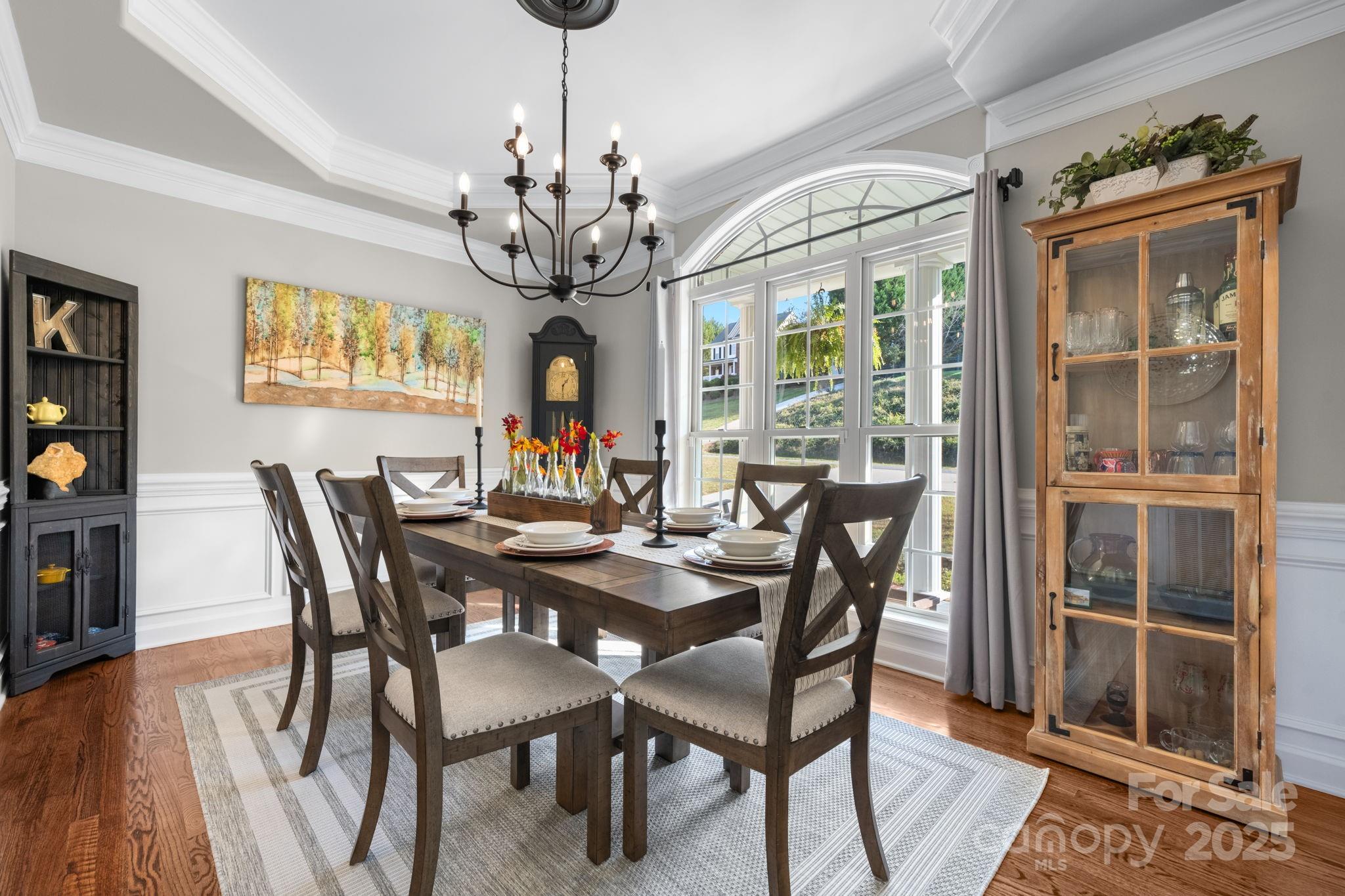 5665 Crown Terrace Hickory, NC 28601 - Photo 20 of 45 a view of a dining room with furniture wooden floor and chandelier