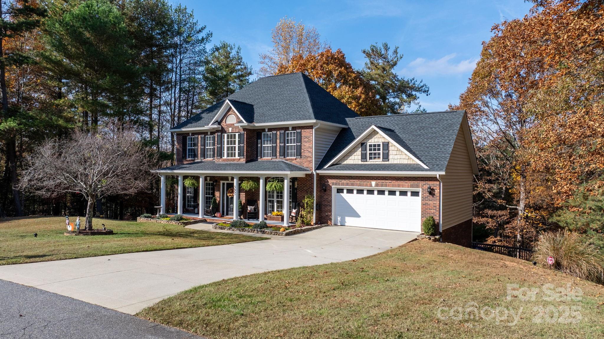 5665 Crown Terrace Hickory, NC 28601 - Photo 2 of 45 a front view of a house with a yard