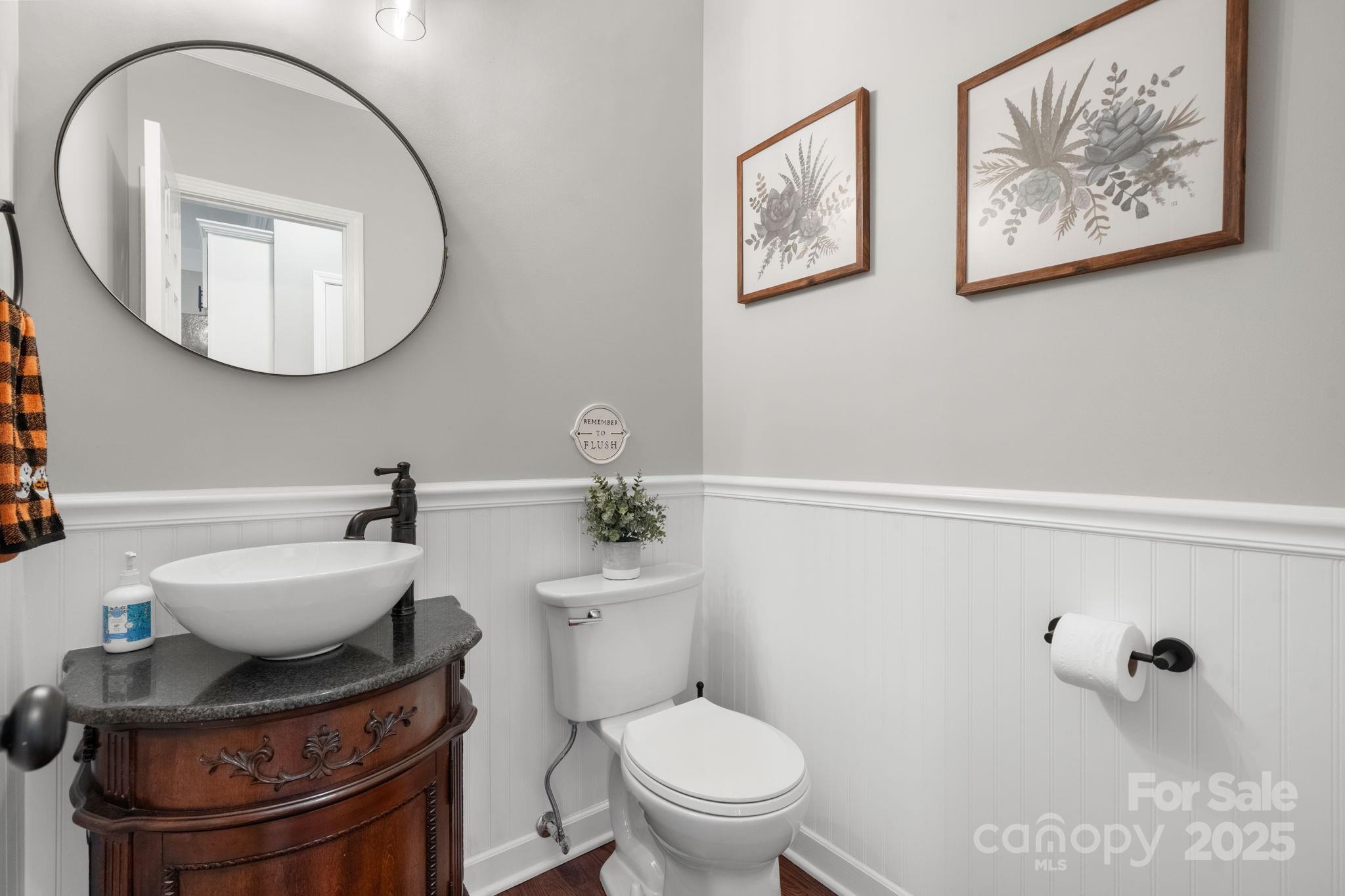 5665 Crown Terrace Hickory, NC 28601 - Photo 23 of 45 a bathroom with a toilet a sink and mirror
