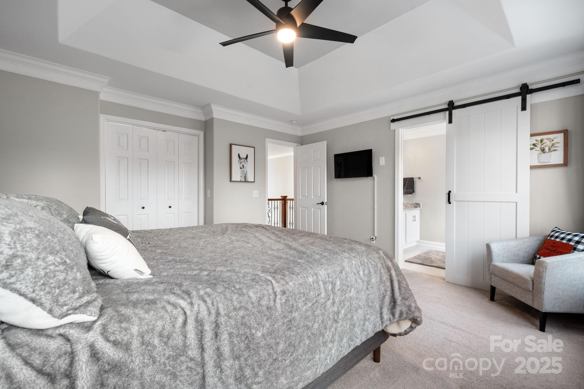 5665 Crown Terrace Hickory, NC 28601 - Photo 28 of 45 a bedroom with a bed and a chandelier
