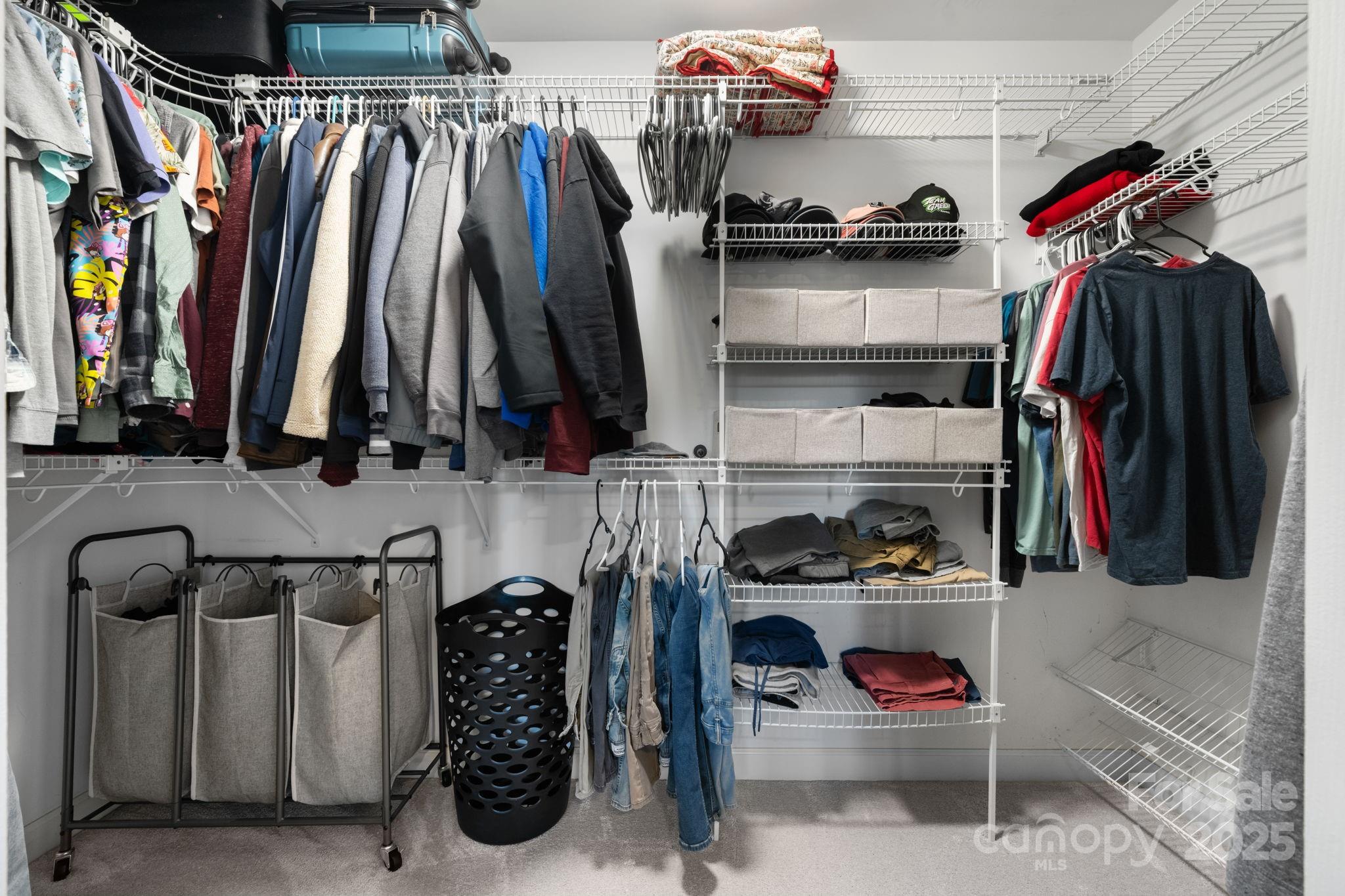 5665 Crown Terrace Hickory, NC 28601 - Photo 32 of 45 a view of walk in closet with clothes and shoes