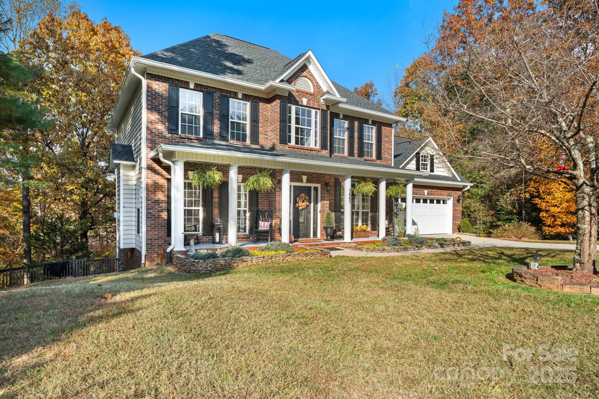 5665 Crown Terrace Hickory, NC 28601 - Photo 4 of 45 front view of a brick house with a yard