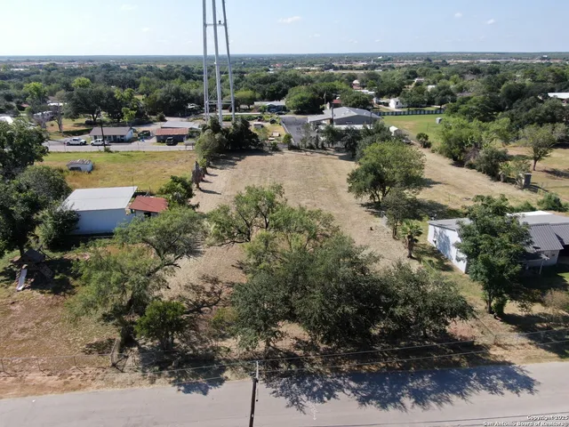 an aerial view of a houses with outdoor space