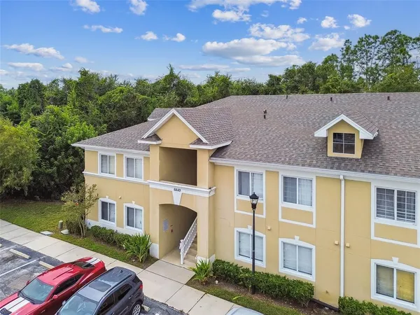 a aerial view of a house with a yard