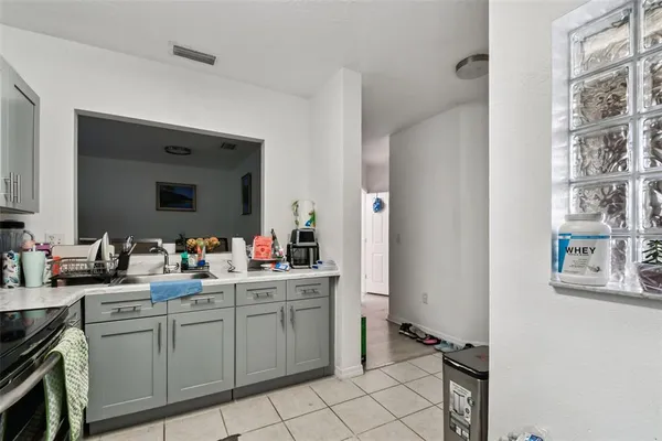 a room that has a sink and a mirror in it