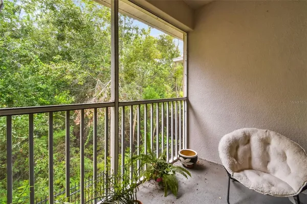 a view of a balcony with chairs