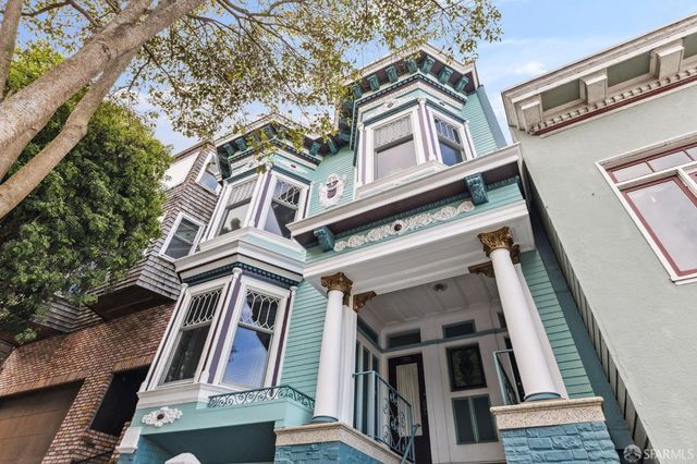 a view of a large building with a clock on the wall