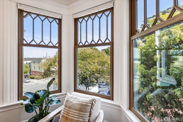 a view of a balcony with wooden floor