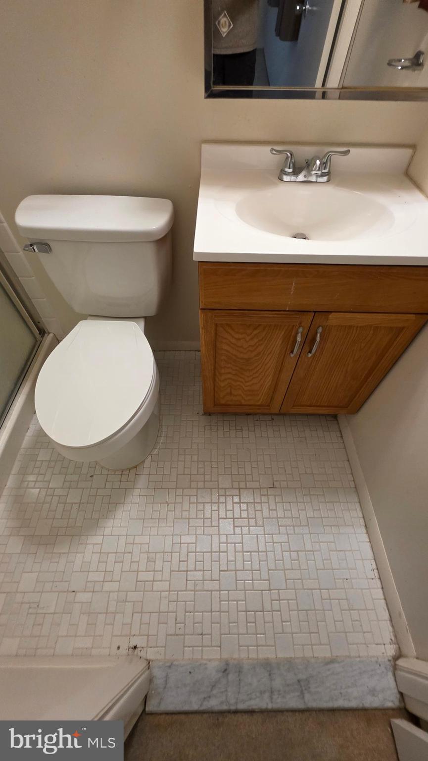 3928 Rolling Rd., Unit C10 Pikesville, MD 21208 - Photo 19 of 26 a bathroom with a toilet