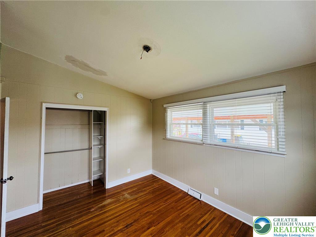 1522 Elayne Street Bethlehem, PA 18017 - Photo 15 of 25 a view of an empty room with wooden floor and a window