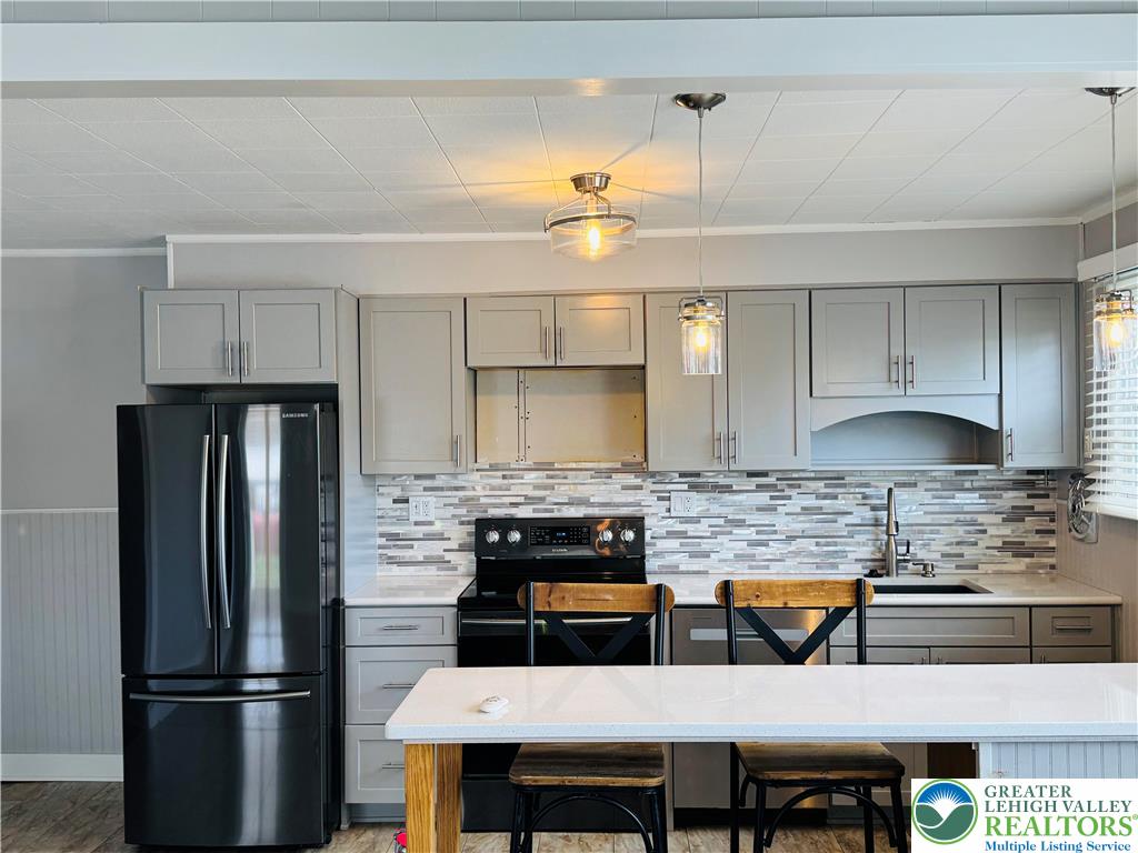 1522 Elayne Street Bethlehem, PA 18017 - Photo 8 of 25 a kitchen with stainless steel appliances granite countertop a refrigerator a stove a sink and a refrigerator