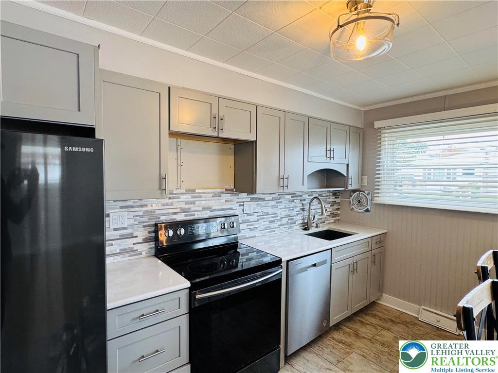 1522 Elayne Street Bethlehem, PA 18017 - Photo 10 of 25 a kitchen with stainless steel appliances granite countertop a sink stove and cabinets