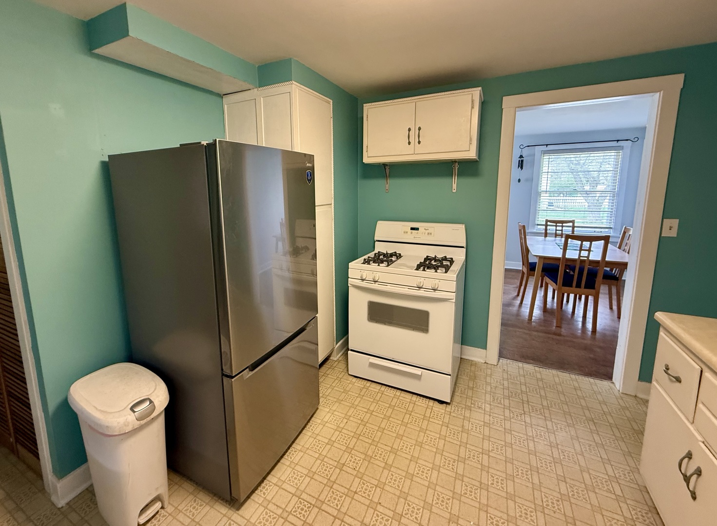 8 North Harrison Street Batavia, IL 60510 - Photo 6 of 22 a kitchen with a refrigerator sink stove and cabinets