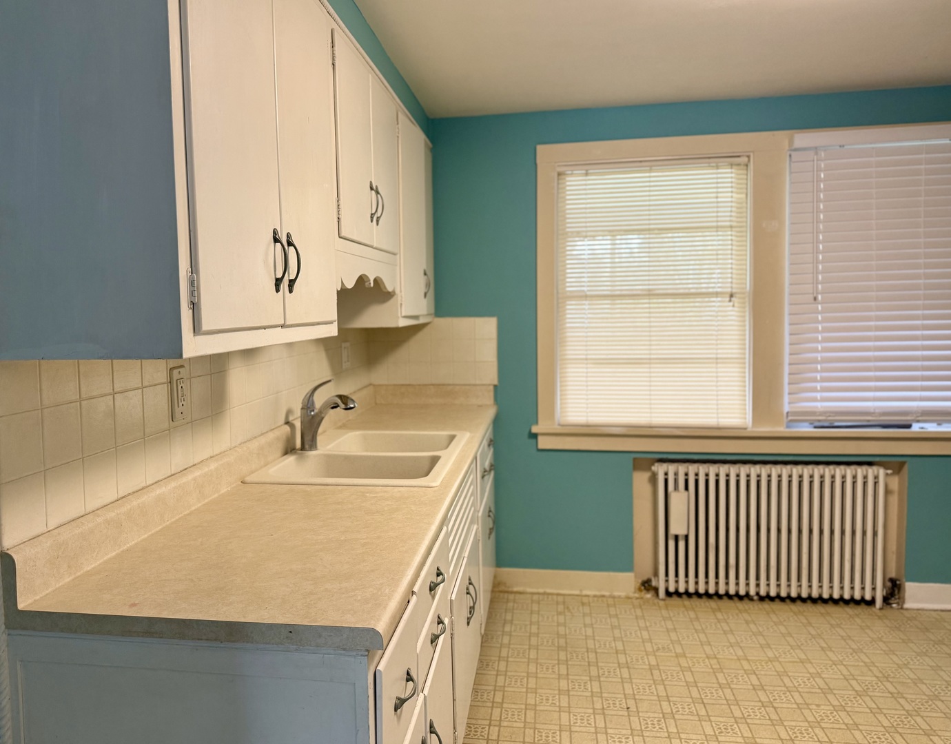 8 North Harrison Street Batavia, IL 60510 - Photo 7 of 22 a bathroom with a sink and a window