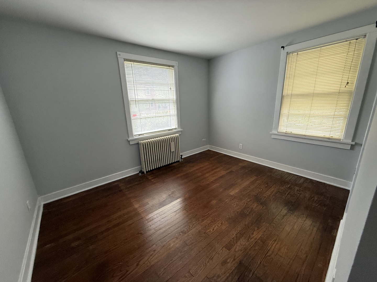 8 North Harrison Street Batavia, IL 60510 - Photo 10 of 22 an empty room with wooden floor and windows