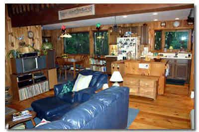 12 Cronk Road Sandisfield, MA 01255 - Photo 3 of 6 a living room with fireplace furniture and a floor to ceiling window