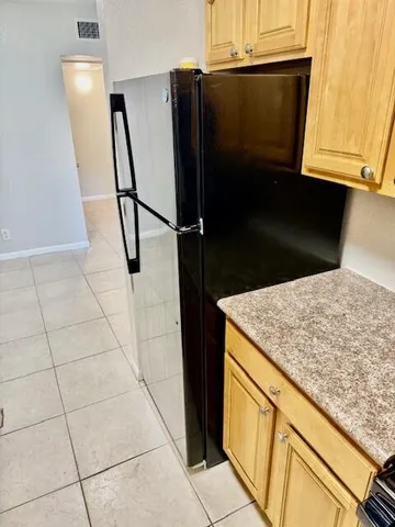 a view of a hallway to rooms and stairs