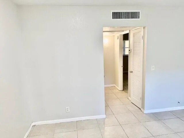 a view of a kitchen cabinets and a stove top oven