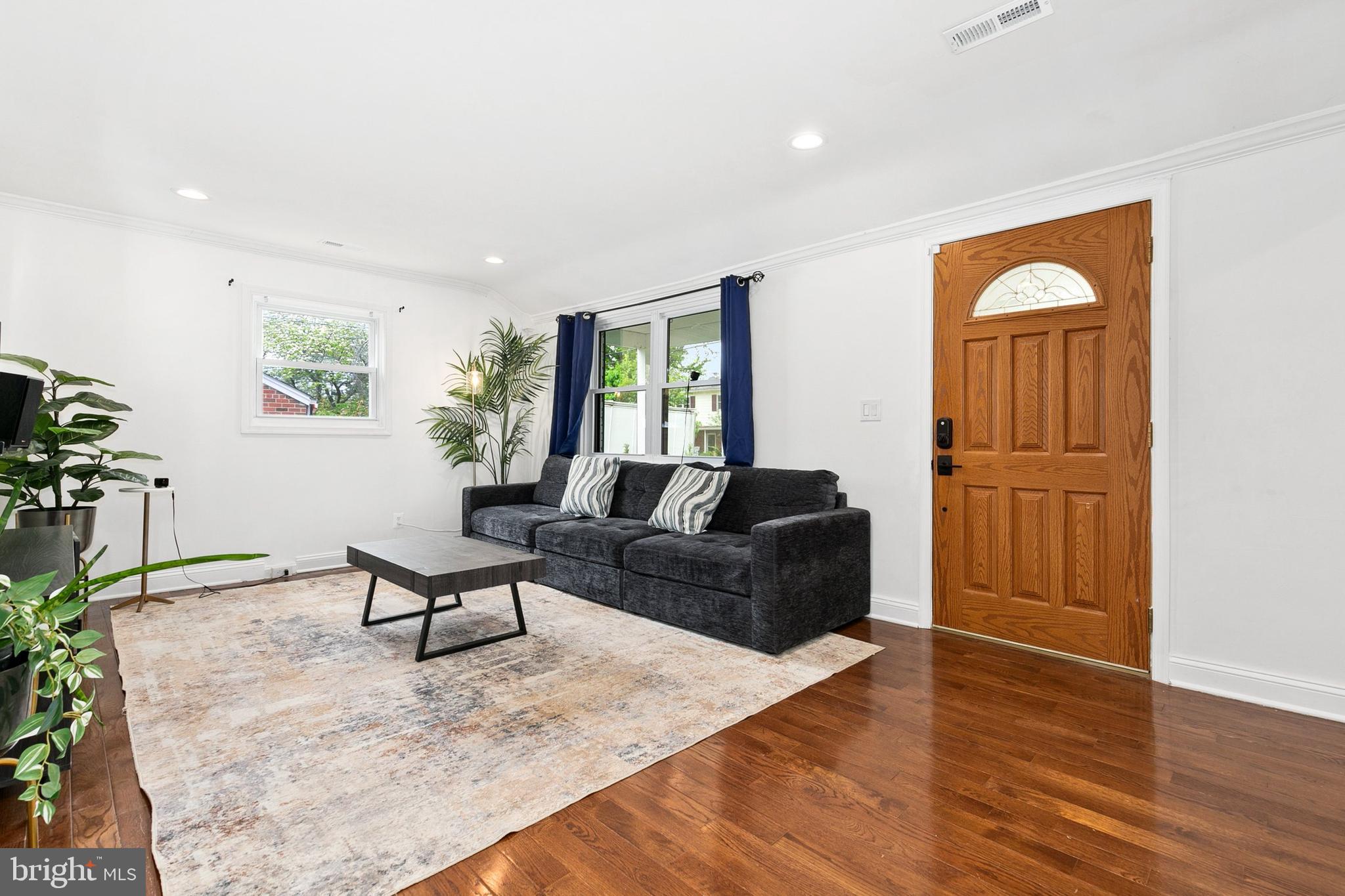 2920 Weisman Road Silver Spring, MD 20902 - Photo 4 of 32 a living room with furniture and wooden floor