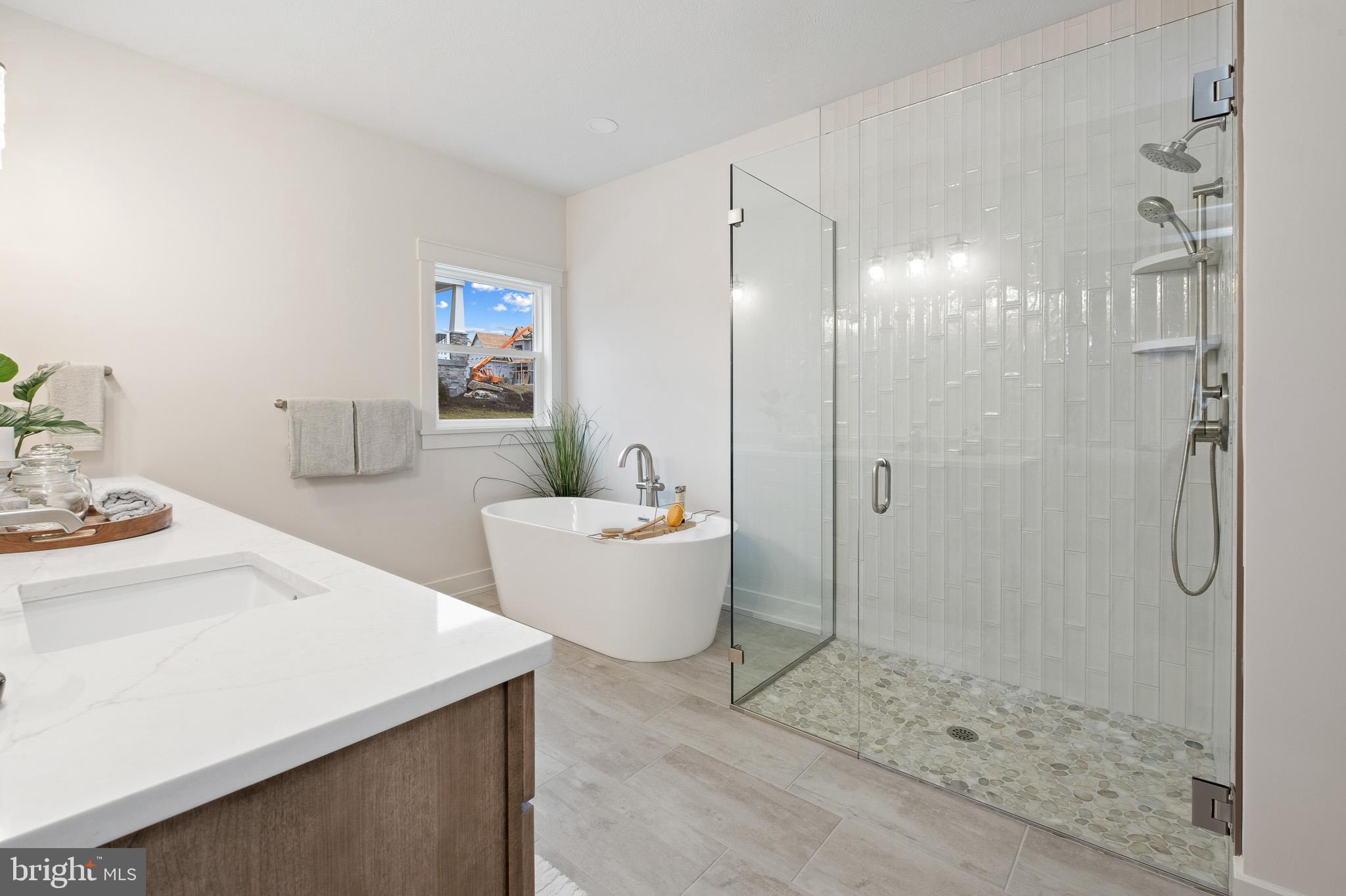 510 Newcomen Road, Unit M1D Exton, PA 19341 - Photo 24 of 34 a bathroom with a tub sink toilet and shower