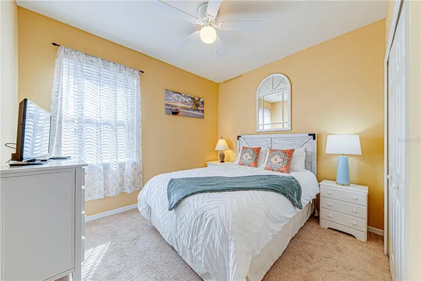 a bed room with a bed and a chandelier