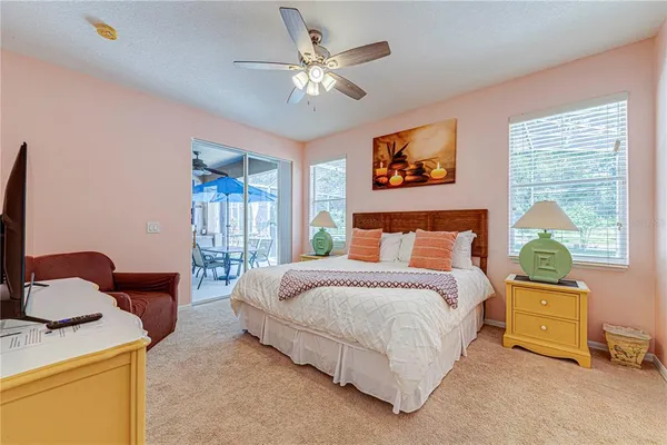 a bedroom with a bed and a couch