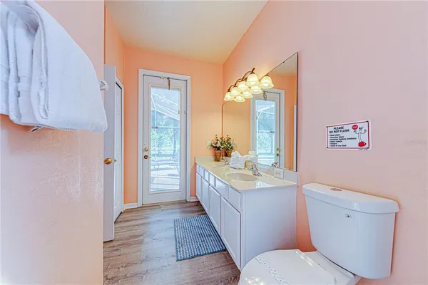 a bathroom with a sink a vanity and a mirror