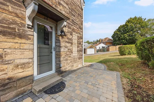 a view of a big room with large windows and a yard