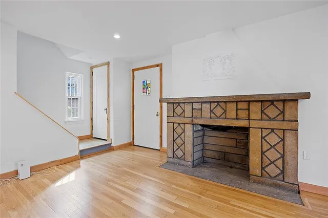 a view of an entryway with wooden floor