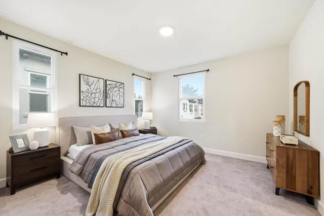 a bedroom with a bed and a cabinets