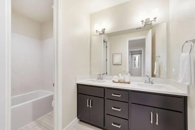 a white bath tub sitting next to a white toilet