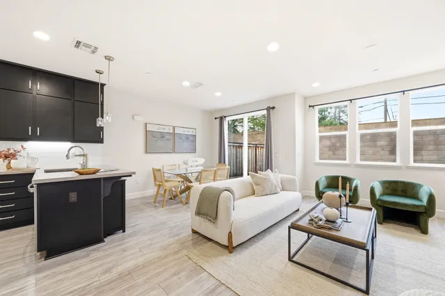 a kitchen with stainless steel appliances a refrigerator and a sink