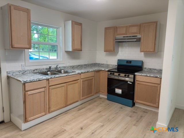 602 South 26th Street Temple, TX 76501 - Photo 3 of 11 a kitchen with stainless steel appliances granite countertop a stove a sink and a wooden floors
