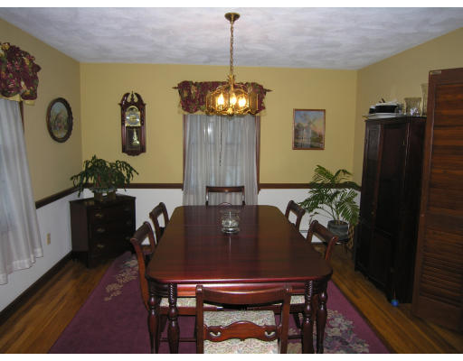 419 Border Road Concord, MA 01742 - Photo 4 of 13 a view of a dining room with furniture and wooden floor