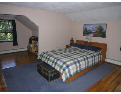 419 Border Road Concord, MA 01742 - Photo 6 of 13 a bedroom with a bed and wooden floor