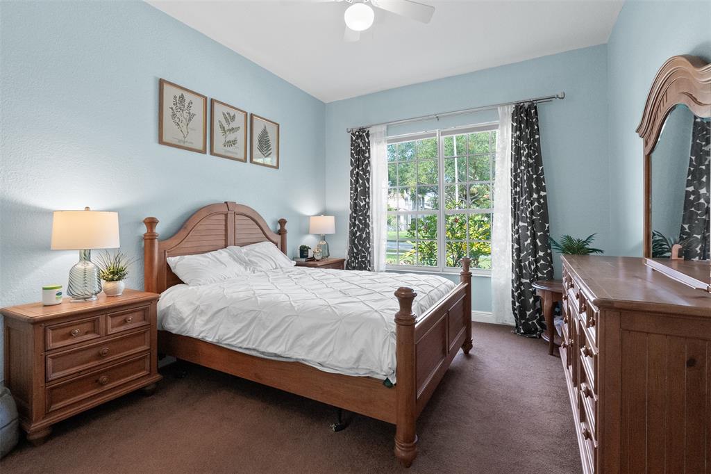 3462 Dovecote Meadow Lane Davie, FL 33328 - Photo 11 of 40 a bedroom with a bed chair and a window